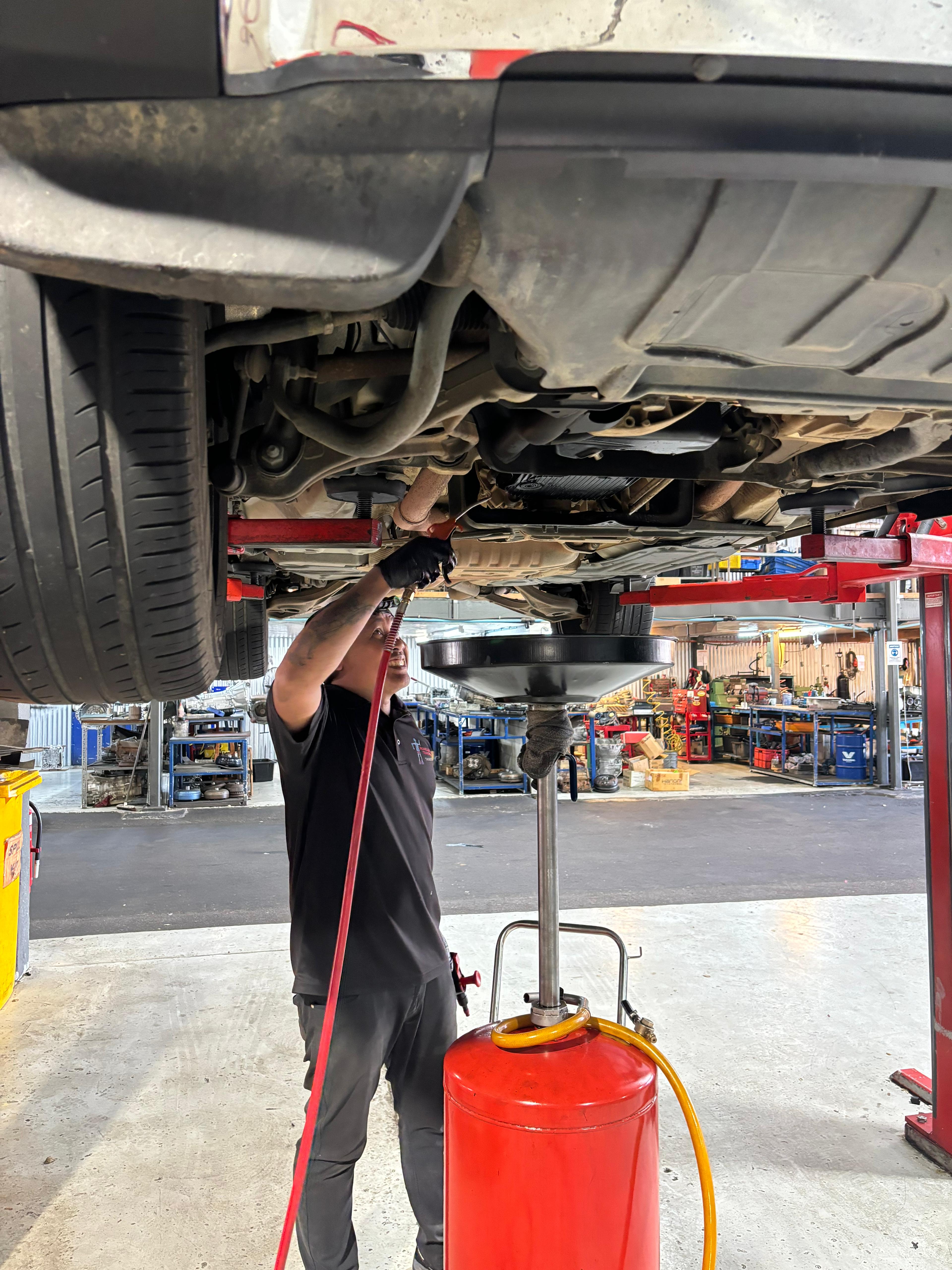 Worker detailing car